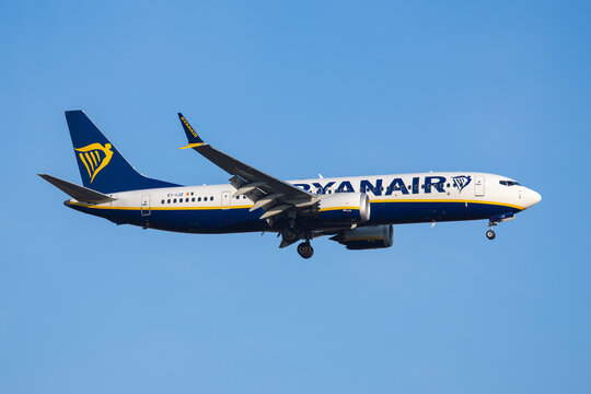 PRAGUE, CZECH REPUBLIC &ndash; March 22, 2026: Ryanair Boeing 737 MAX 8-200 REG:EI-IJZ passenger airplane with landing gear extended flying against a clear blue sky during final approach.