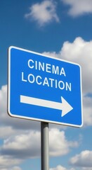 Fototapeta premium Cinema Direction Sign Pointing Towards Entertainment Under Blue Sky With Clouds