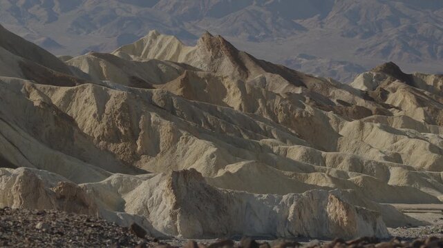A panning shot of Zabriskie Point landscape near Death Valley, CA