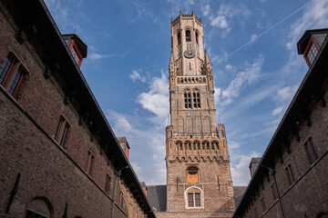 Naklejka premium The Belfry of Bruges (Belfort) from the courtyard - Bruges, Belgium