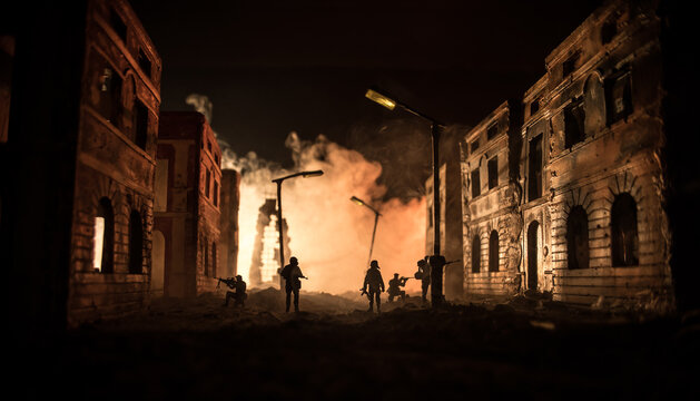 War Concept. Military silhouettes fighting scene on war fog sky background, World War Soldiers Silhouette Below Cloudy Skyline At night. Battle in ruined city.