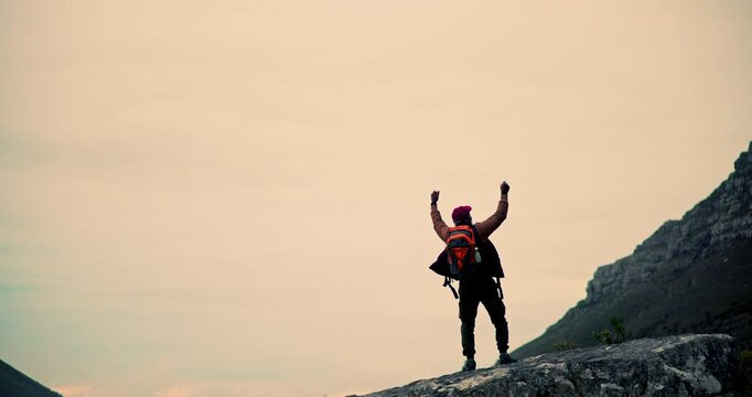 Man, hiker and fist pump with backpack on mountain cliff for achievement, victory or winning in nature. Back view of male person in celebration on rock for adventure, conquer or goals on mockup space