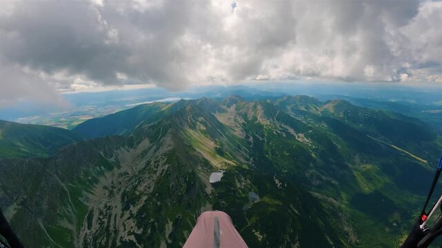 POV Paragliding Flight High Above Green Alpine Mountains