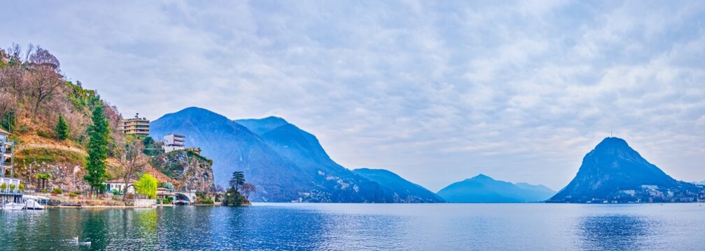 Panoramic view of Monte Bre, Monte San Salvatore and lakeside village houses in Lugano, Switzerland