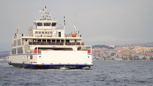 Close up. In-city vehicles carrier approaches the port of Sirkeci. Istanbul, Turkey. Car ferry or Roll-on Roll-off as RoRo