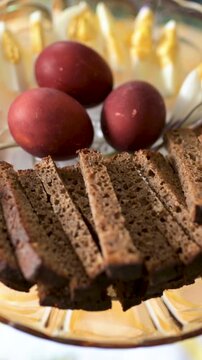 Traditional Easter breakfast food in Lithuania. Lithuanians also include a variety of cold dishes, freshly baked bread, boiled painted eggs, hams, sausages, fresh vegetables. Celebrating Easter.