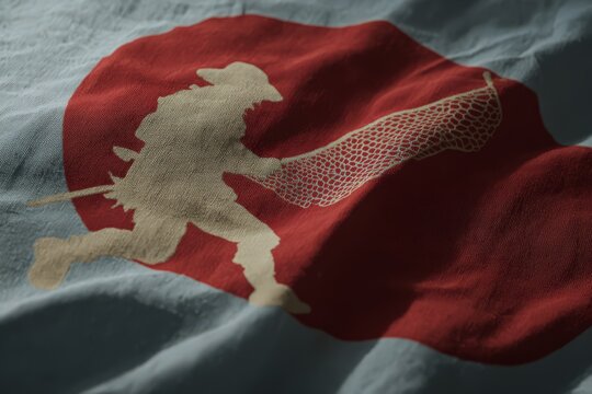 Fisherman casting net on flag representing profession with a focus on fishing culture in a coastal region during daytime