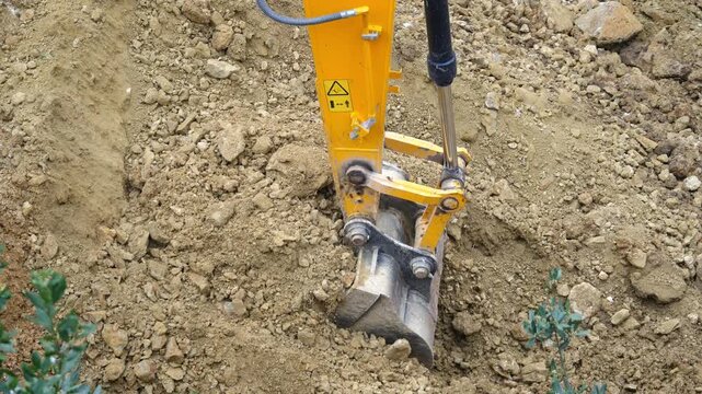 Excavator bucket operation for soil lifting. Important: Do not widen the swing radius after lifting a load. Keep lifting distance as short as possible when loading or transporting