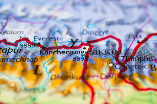 Detailed topographic map of Bhutan and eastern Himalayas with highlighted national borders and mountain ranges.