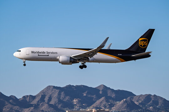 sky harbor airport 3-14-2026 Phoenix, AZ USAUPS Boeing 737-300F N329UP sunset arrival at Phoenix Sky Harbor Intl. Airport.