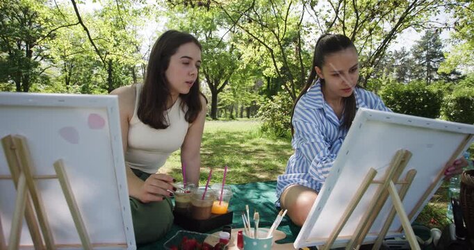 Two Friends Painting in the Park: A Relaxing Afternoon of Art, Nature, and Creative Expression