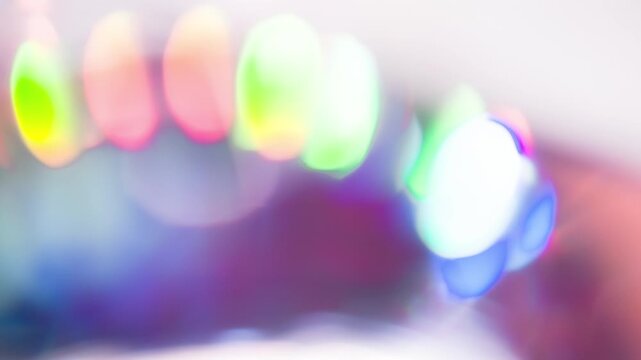 Round Dance of Light Glares. Light passes through the facets of a slowly rotating faceted crystal, creating repeating sparkling reflections and iridescent colors