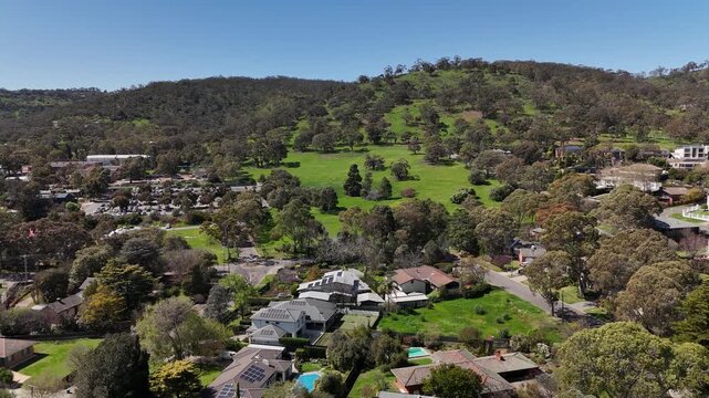 Springfield, South Australia: 4K aerial drone footage of Adelaide Hills suburb, green landscapes, residential houses, tree-covered hills and scenic countryside near Waite campus, Waite Arboretum