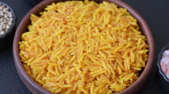 Kabsa or haneeth, an Arabic dish with rice and chicken, salt, and spices. Kabsa or haneeth as a food background for your design