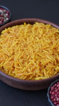 Kabsa or haneeth, an Arabic dish with rice and chicken, salt, and spices. Kabsa or haneeth as a food background for your design