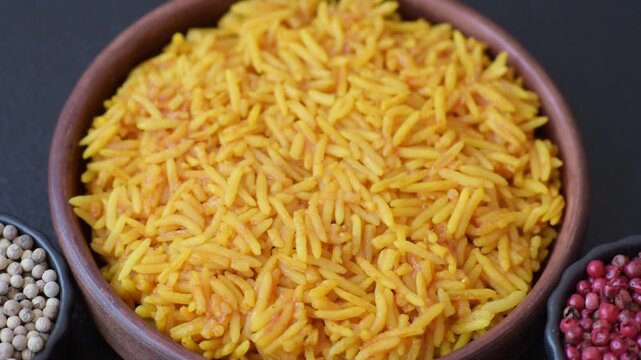 Kabsa or haneeth, an Arabic dish with rice and chicken, salt, and spices. Kabsa or haneeth as a food background for your design