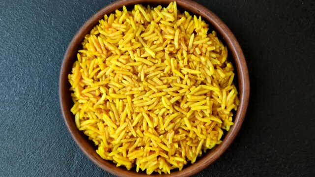 Kabsa or haneeth, an Arabic dish with rice and chicken, salt, and spices. Kabsa or haneeth as a food background for your design