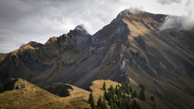 Aerial view of rugged peaks pierce the sky, their slopes painted with hues of ochre and umber, a silent testament to nature's grandeur, Glieres-Val-de-Borne, Auvergne-Rhone-Alpes, France.