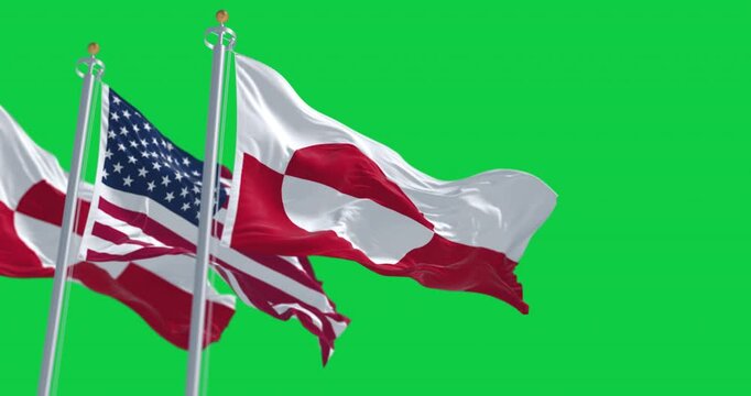 Flags of Greenland and the US waving in the wind isolated on green background
