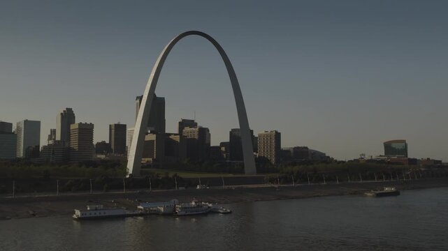 An aerial shot past the gateway Arch in late afternoon, St. Louis, MO