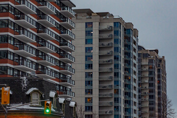 Urban High-Rise Apartment Buildings at Dusk with City Traffic Lights © Michael Cox