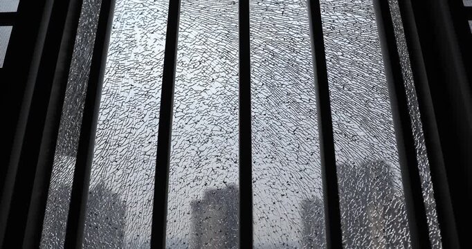 Broken window glass of modern apartment