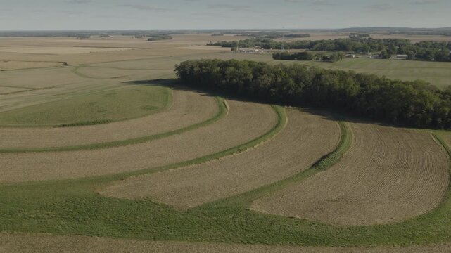 An Aerial flyover farmland and woods near Tower Hill, IL