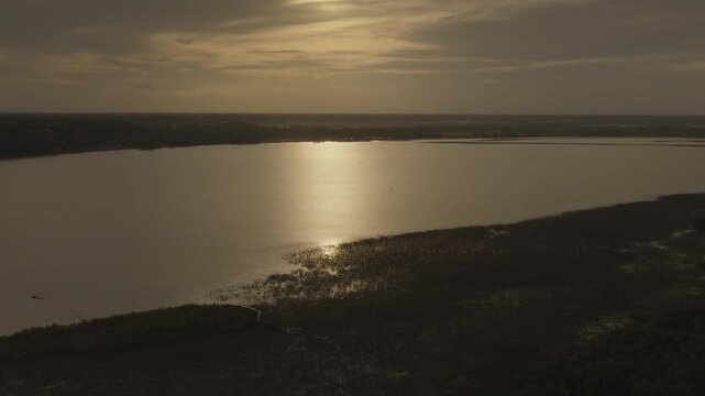 An aerial flyover the Mississippi river at dusk near Nauvoo, IL