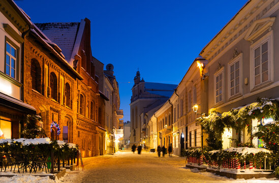 Night view of Pilies Street, oldest and most ornate street in Old Town of Vilnius, Lithuania