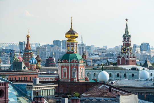 Colorful domes of Saint Basil&rsquo;s Cathedral, Epiphany Monastery and Spasskaya Tower of the Kremlin, Moscow, Russia.