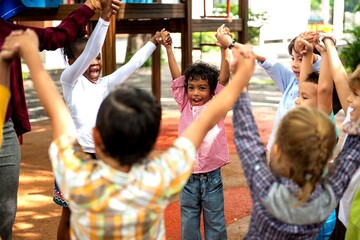 Naklejka premium Joyful children playing together outdoors.