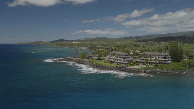 An aerial flyover of the south coast of Kauai near Poipu, Kauai, HI