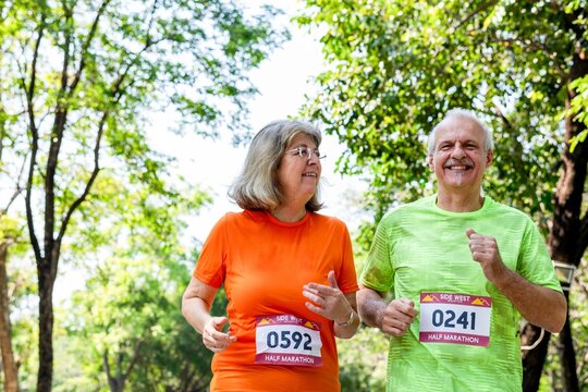 Senior couple enjoying marathon outdoors.