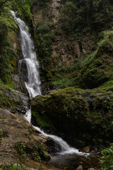 Fototapeta premium Pristine Tropical Waterfall Cascada Norte in Waraira Repano National Park. Hidden gem along the Rio Norte river in the lush mountains of Guatire, Miranda, Venezuela