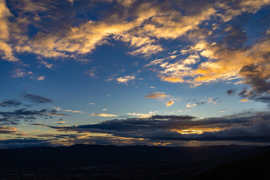 Cityscape View from Waraira Repano Mountains at Dusk. Panoramic view of the urban horizon at sunset, captured from the high-altitude trekking trails of Guatire, Miranda, Venezuela. South America