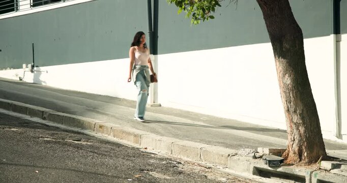 Diverse pedestrians responding to empty ramp, walking up ramp under tree, carrying bags, copy space