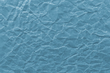 Obraz premium Textured blue crumpled paper background