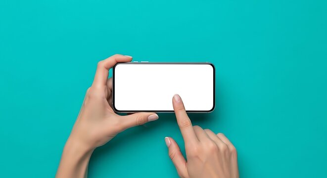 Feminine hands holding and interacting with a modern smartphone displaying a blank white screen, horizontal orientation on a vibrant teal backdrop, studio shot, clean aesthetic.