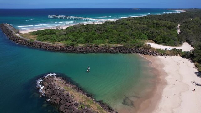 Boat Anchored In Marlo's Beach With Tweed Sand Bypass In The Distance In NSW, Australia. - aerial shot