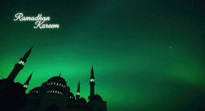 Ramadan Kareem Islamic Mosque Silhouette with Green Sky Background.