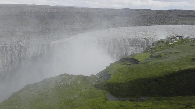Dettifoss waterfall and water vapor in the summer, Iceland