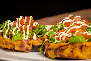 Tostones with lettuce tomatoes and mayo-ketchup © Ricardo Espinoza L