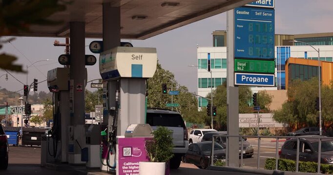 A gas station displays high gas prices, nearing $8 dollars a gallon.