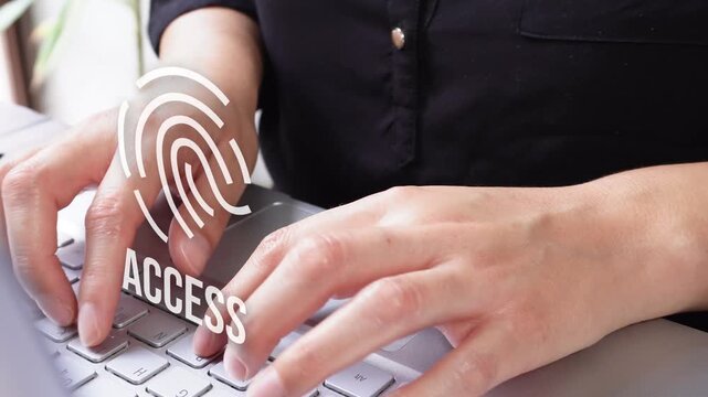 Close-up of a businesswoman's hands typing on her laptop with an animated fingerprint displaying the word "Access." Biometric access.
