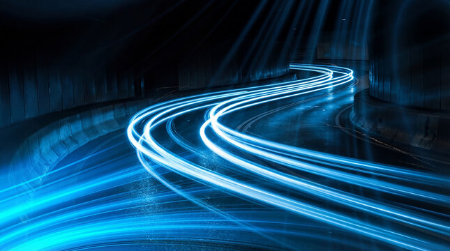 Abstract long exposure photograph of vibrant blue light trails curving sharply on a dark, wet road, symbolizing speed.