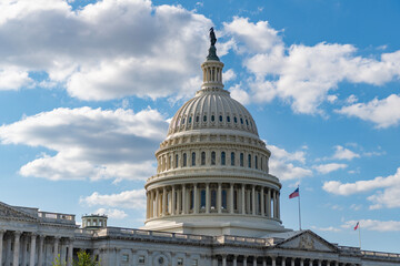 Naklejka premium Capitol dome. Historic Capitol by the national flag. Capitol dome as symbol of law. Washington monument architecture. Washington DC. US Senate