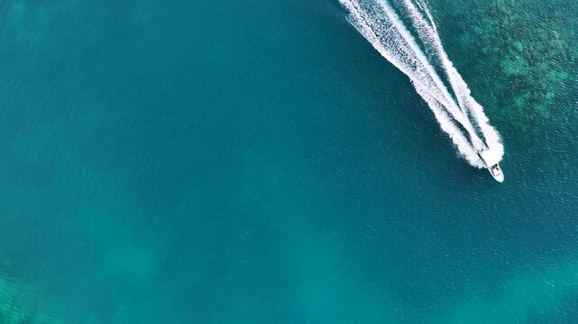 Aerial View of Speedboat Cruising Through Turquoise Palau Waters