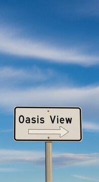 Oasis View Signage Directing Towards a Scenic Destination Under a Vast Sky