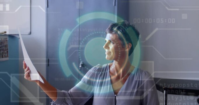 Vertical video: Designer lifting proofs from left and checking comps while HUD guiding, smiling