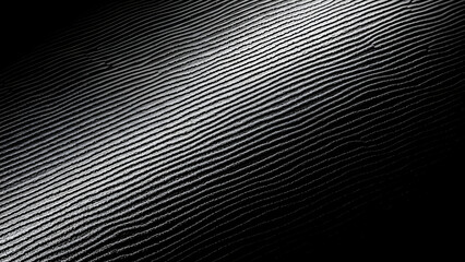 Obraz premium A close-up view of a shiny surface with a gradient light reflection.